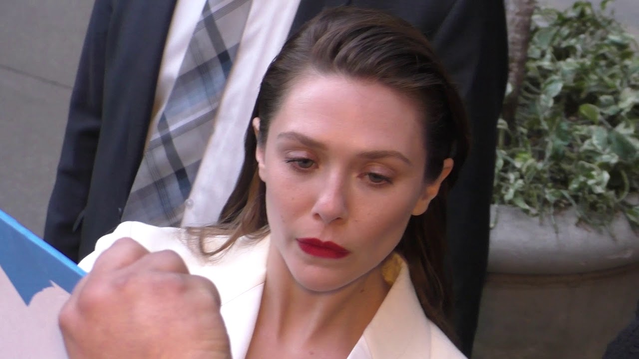 Elizabeth Olsen signs for fans outside the premiere of Netflix’s Kodachrome at ArcLight Cinemas in H