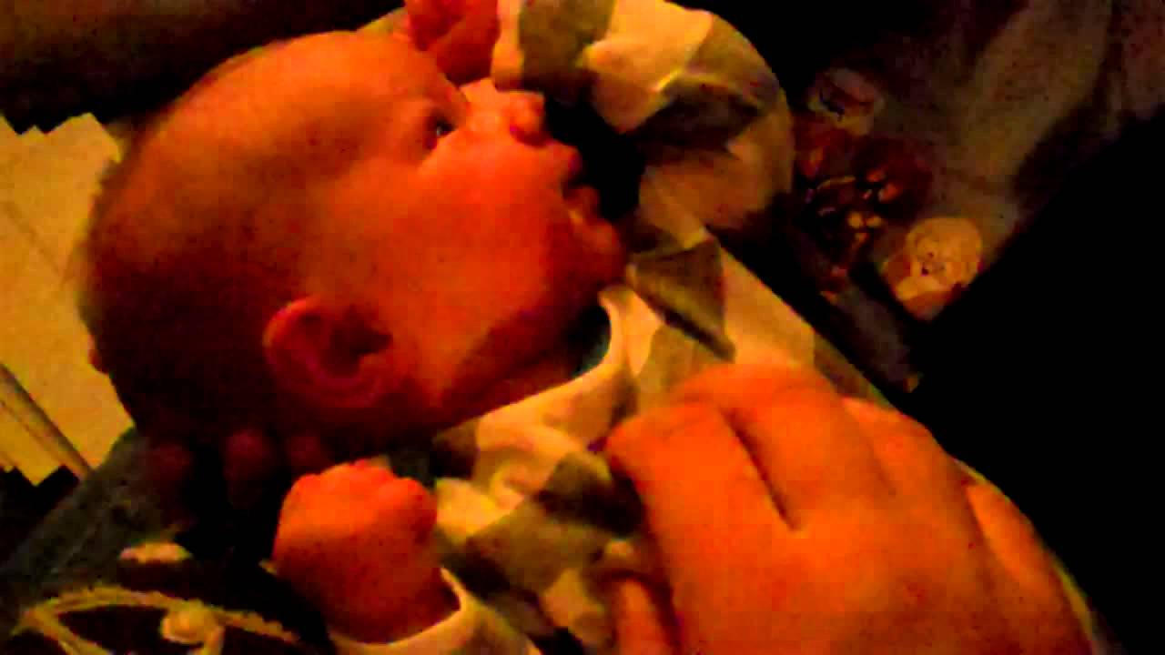 Blowing air on hot baby's face