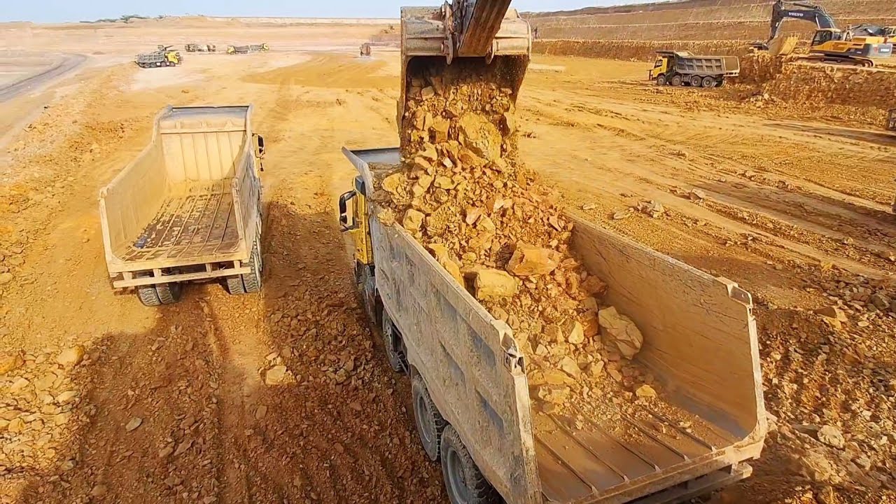 Mining Site Full Of Caterpillar & Liebherr Excavators And Fleet Of Trucks - Ascon Ltd