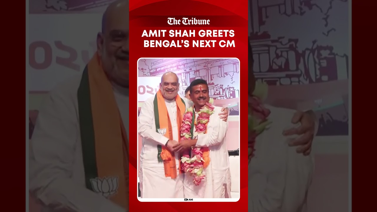 Amit Shah hugs, garlands Suvendu Adhikari as BJP leader set to become Bengal CM
