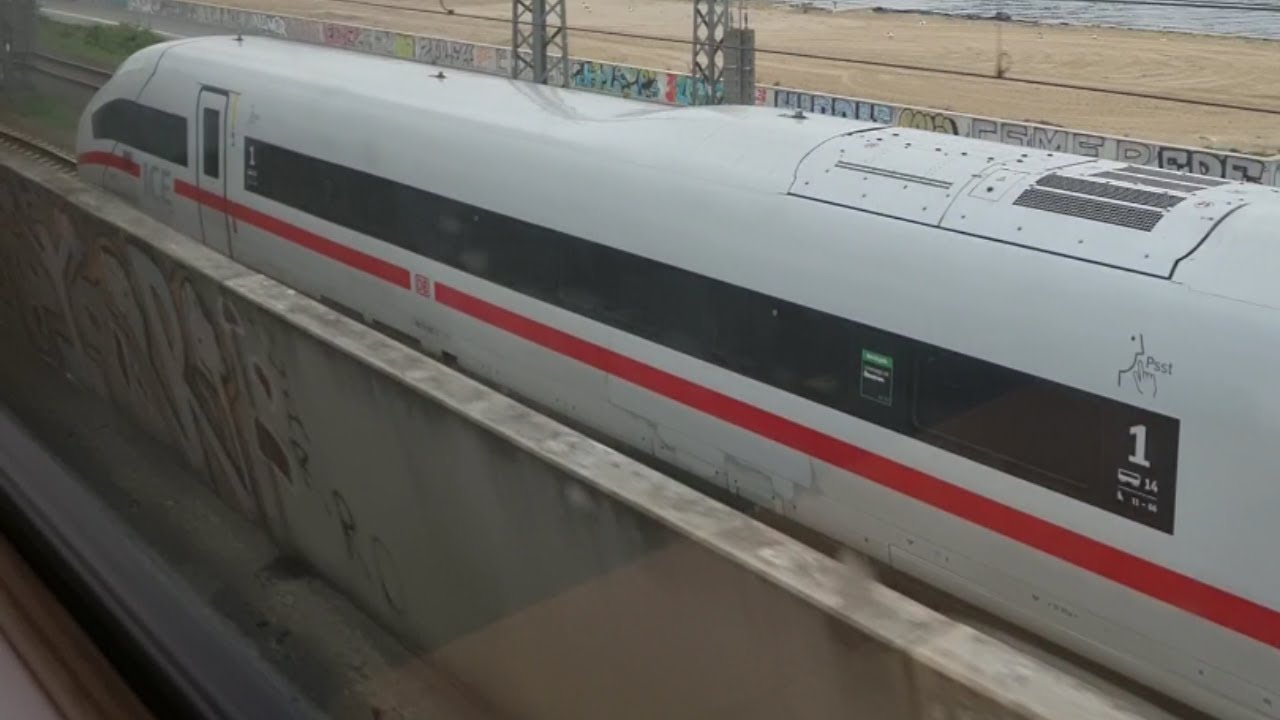 Germany: Running alongside an ICE 4 Intercity-Express high-speed train on the approaches to Hamburg