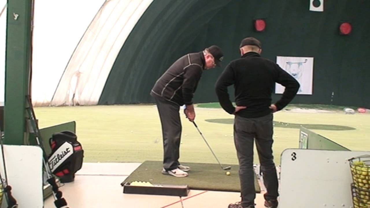 Hands close to the body on downswing