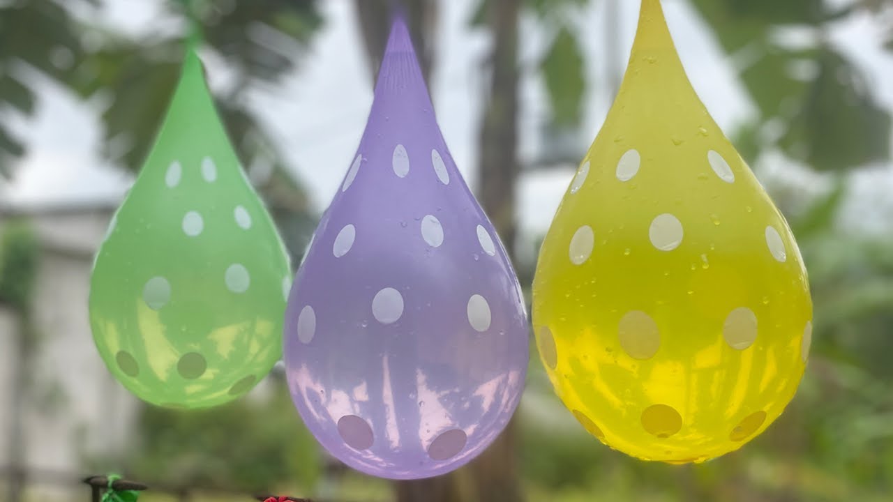 BLOWING UP WATER BALLOONS, BURNING LARGE WATER BALLOONS, MAKING FLOODS FROM BURST BALLOONS