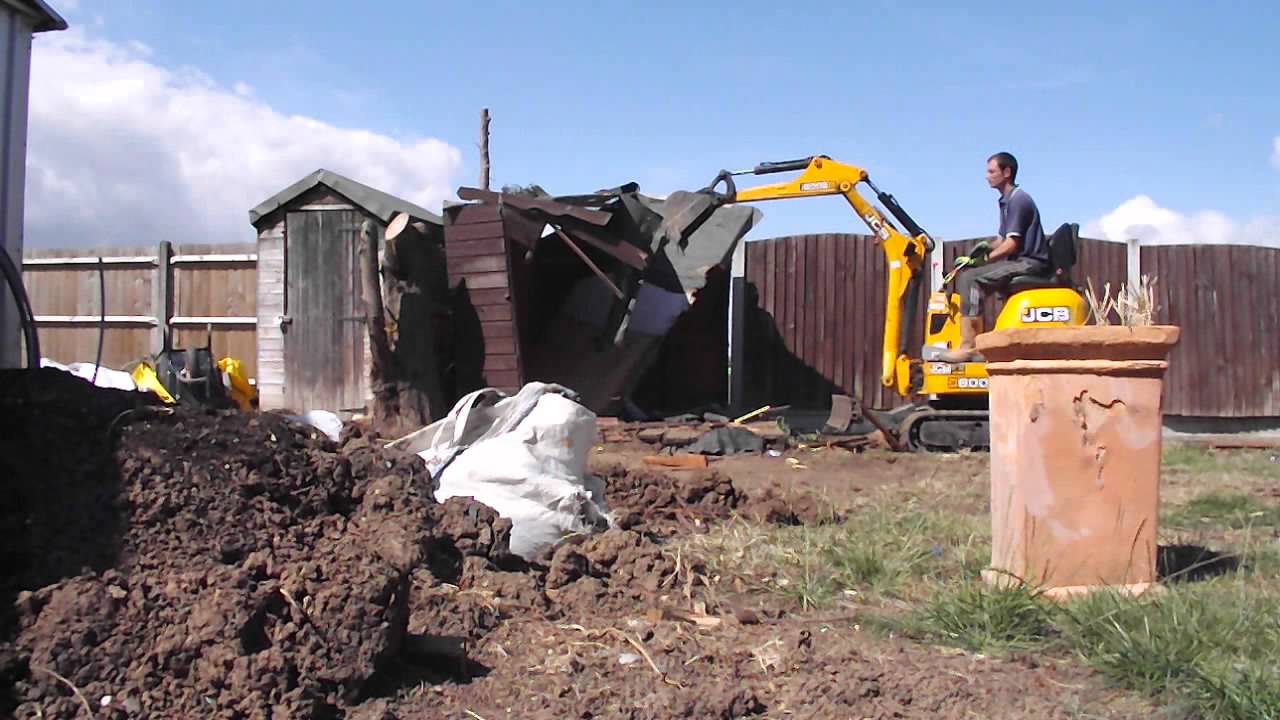D.M.S Micro Digger Hire. Removal of a garden shed with JCB 8008