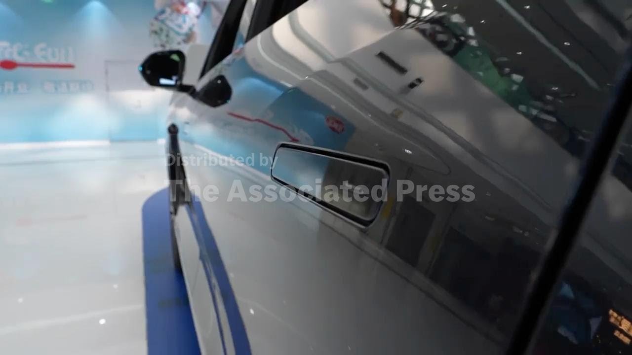 China plans to ban hidden door handles on cars over safety concerns; AP explains