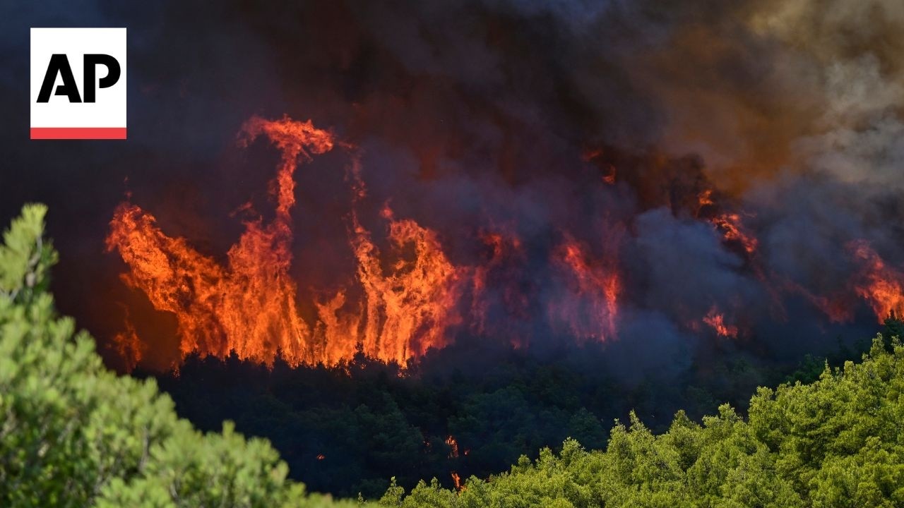 Strong winds fuel a major wildfire burning in a seaside area on the Greek mainland