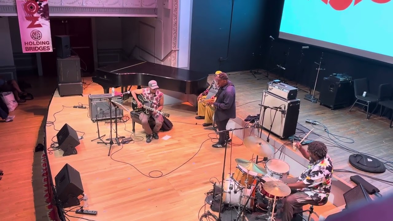 James Blood Ulmer persuades Vernon Reid to come up play a song with his band.