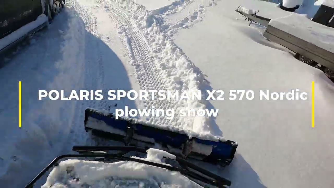 POLARIS SPORTSMAN X2 570 plowing snow.