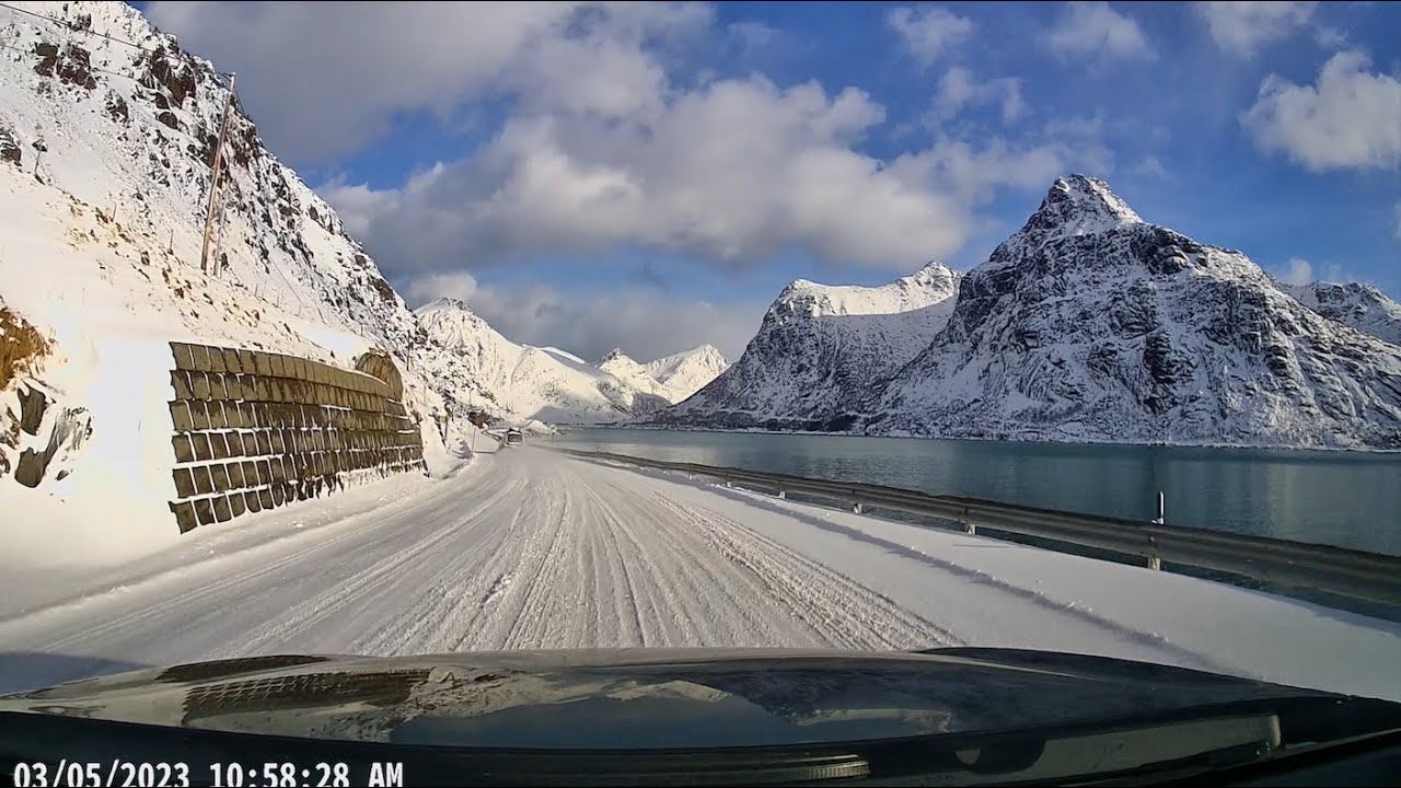 Driving along the E10 through the snow in Lofoten, Norway