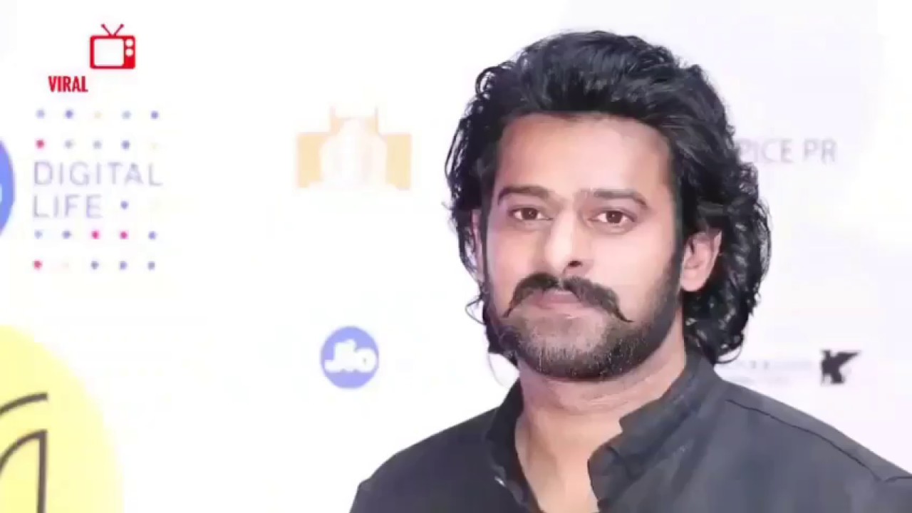 Prabhas and Anushka look at each other several times and smile during interview..see the LOVE
