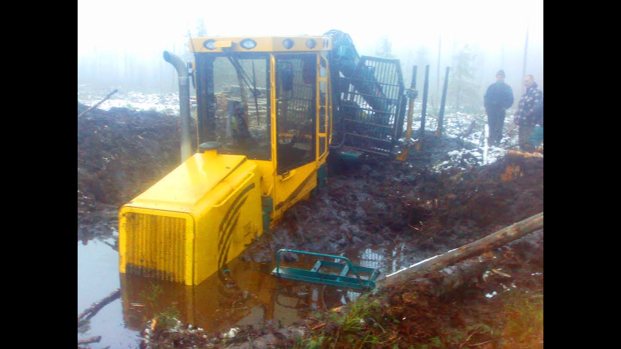 Forwarder HSM 208F stuck in deep mud, saving with T- 40AM, Valmet 840 and Mtz tractor