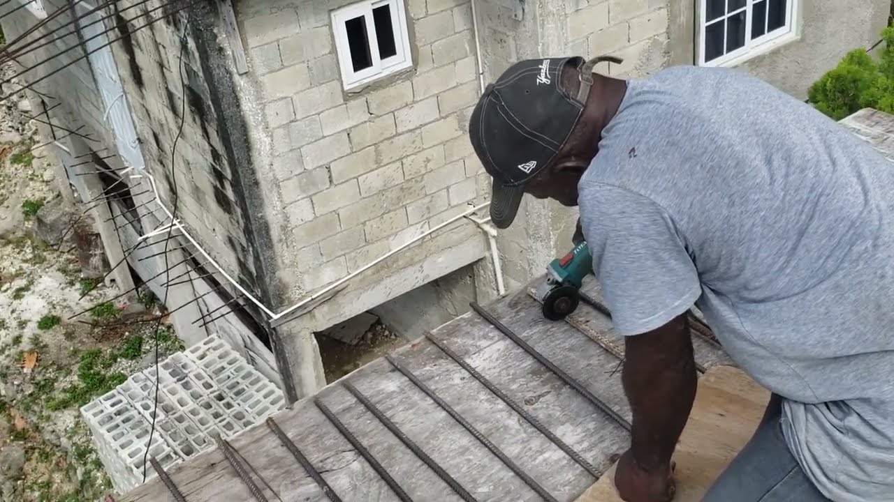 Carpenter  putting  up balcony Decking extension🤔/Client dream house project Montego bay Jamaica