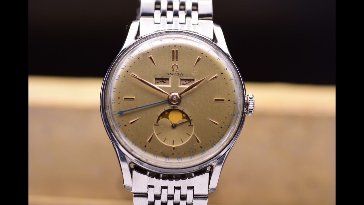 Lot 40 Omega Cosmic: A Fine & Rare Triple Calendar Wristwatch Moon Phase Arabic Ref. 2471 C.1950