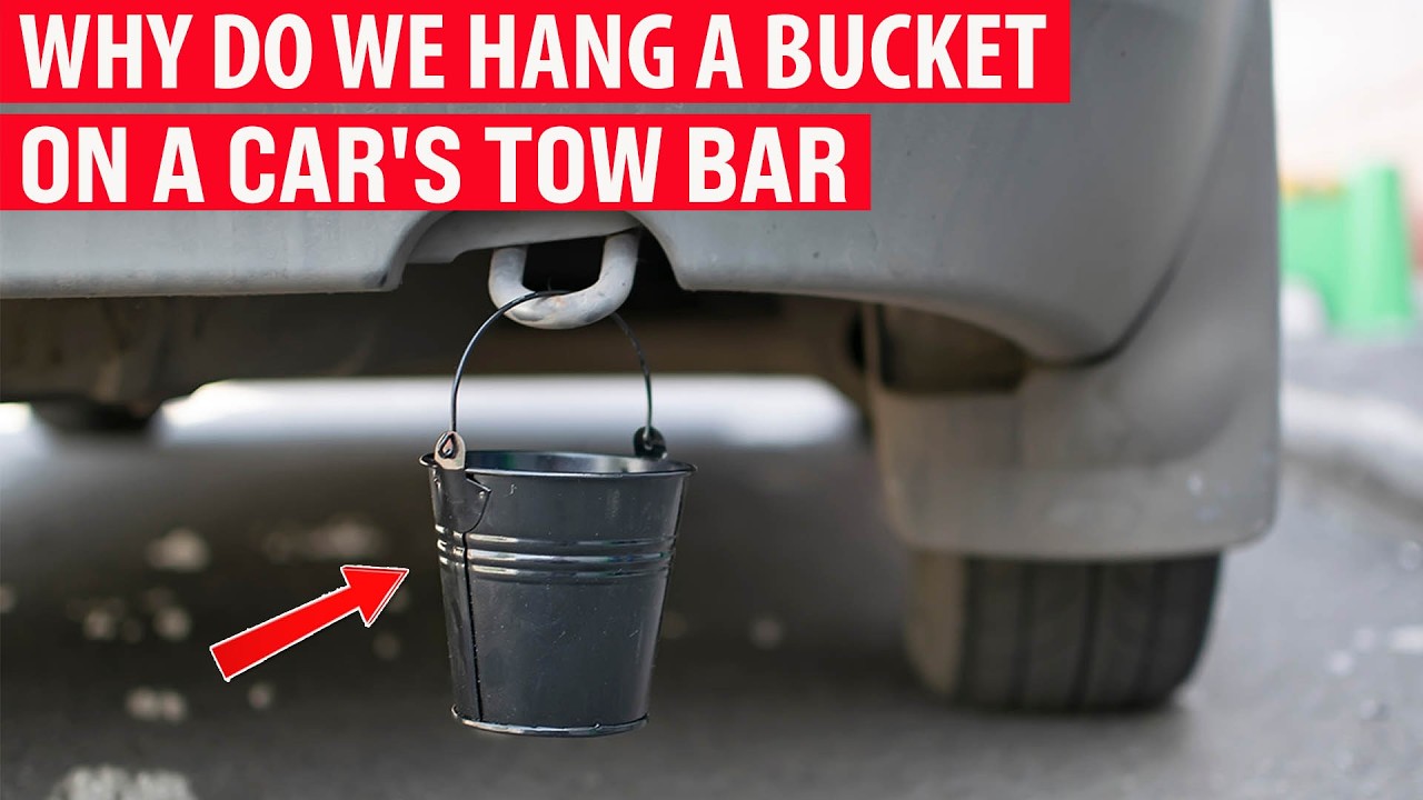 Why do drivers hang a small bucket on their car's towbar?