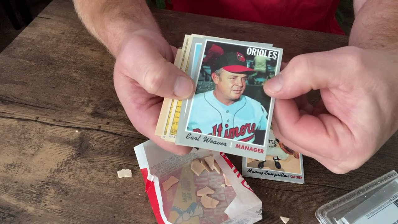 Opening a 1970 Topps baseball card pack on camera