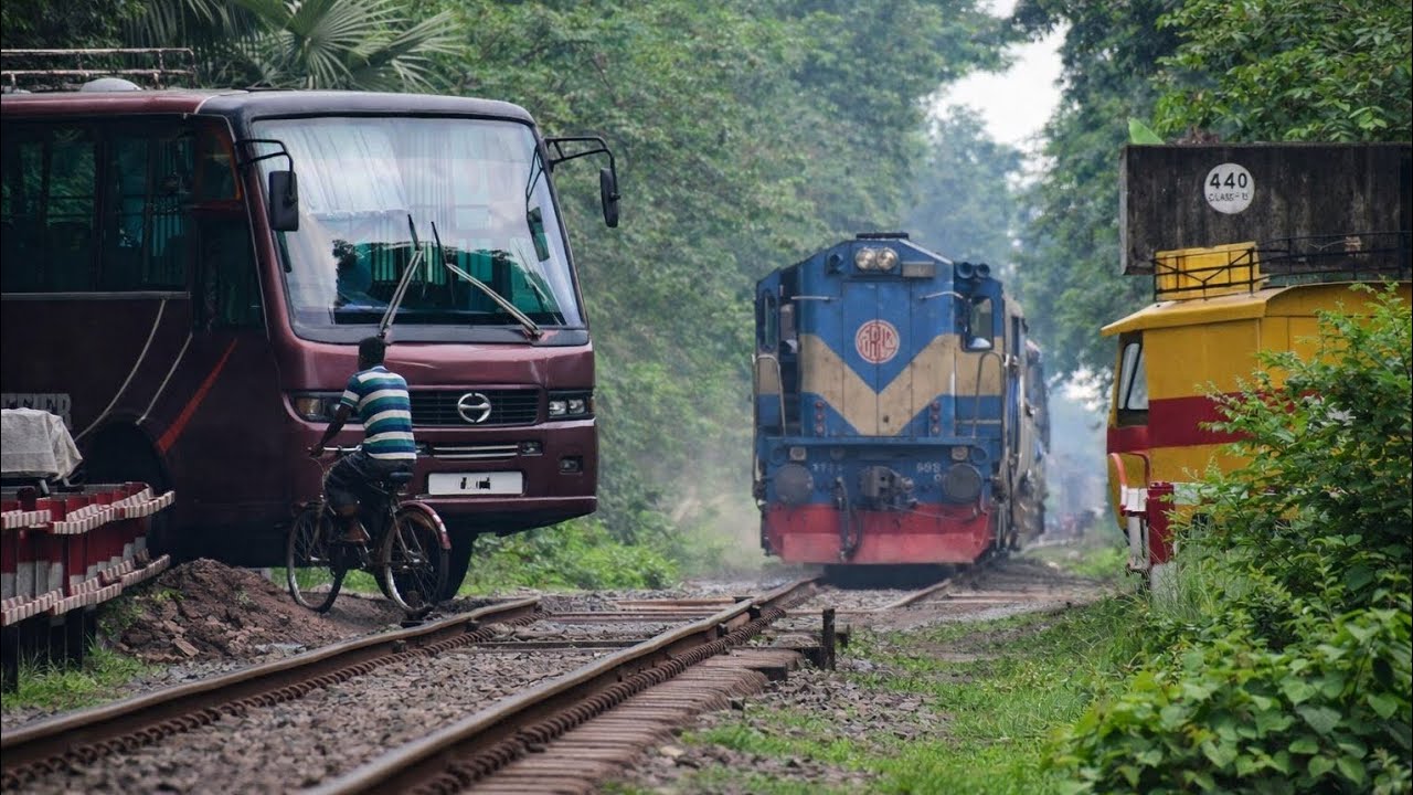 Train passing through a busy Rail Crossing/ Gate- Benapole Commuter of Bangladesh Railway