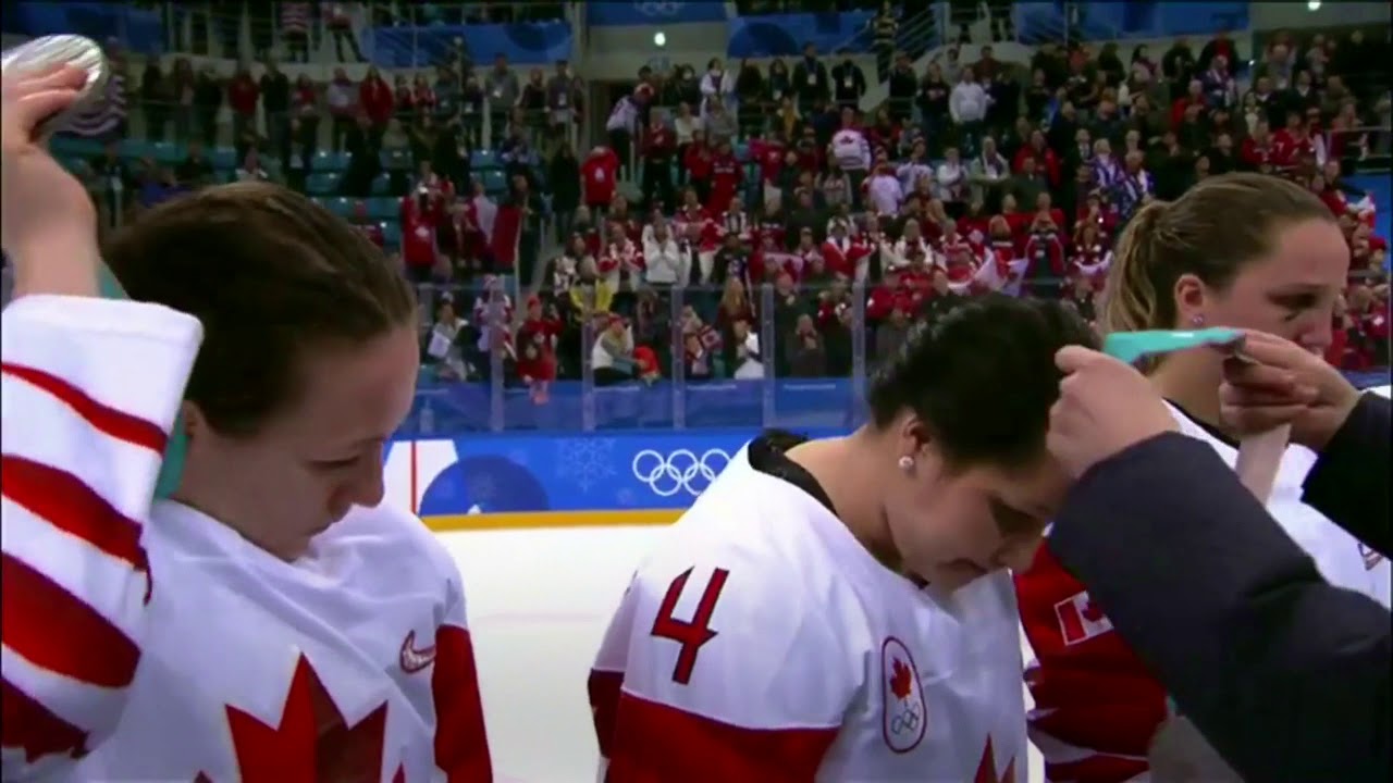 Canada&rsquo;s Jocelyne Larocque takes off silver medal moments after receiving it.