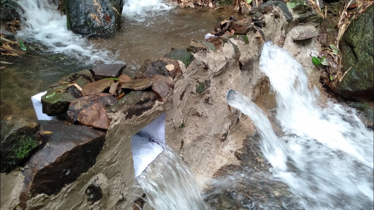 mini dam construction || primitive technology: build a stone dam || dam water release ||