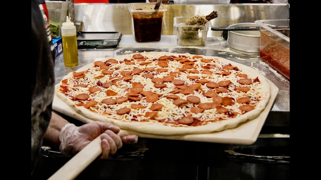 Can't get the pizza off the peel and into the oven? Want to improve your dough stretching technique?