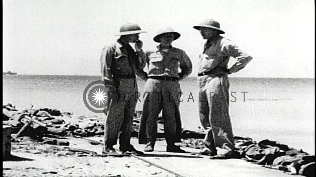 US soldiers on the damaged beach of Enewetak, Marshall Islands after its capture ...HD Stock Footage