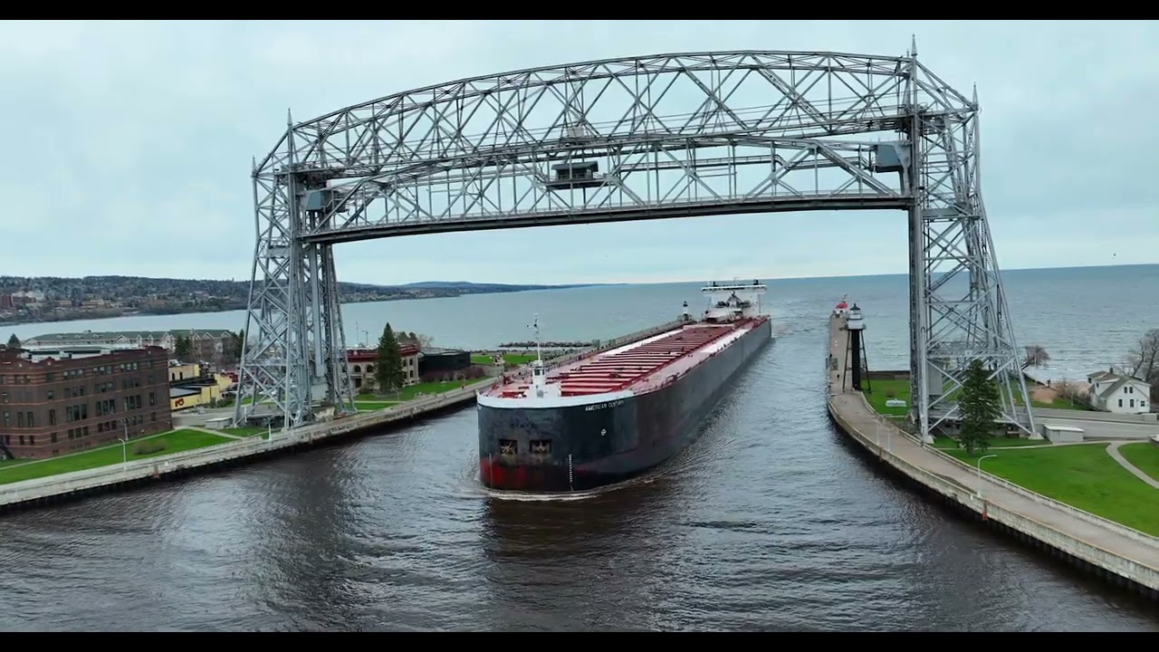 American Century with salute under the Duluth Aerial Lift Bridge heading for Midwest Energy