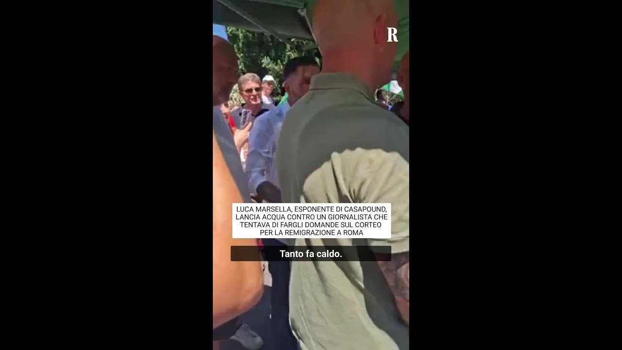 Luca Marsella of Casapound throws water at a journalist in Rome.