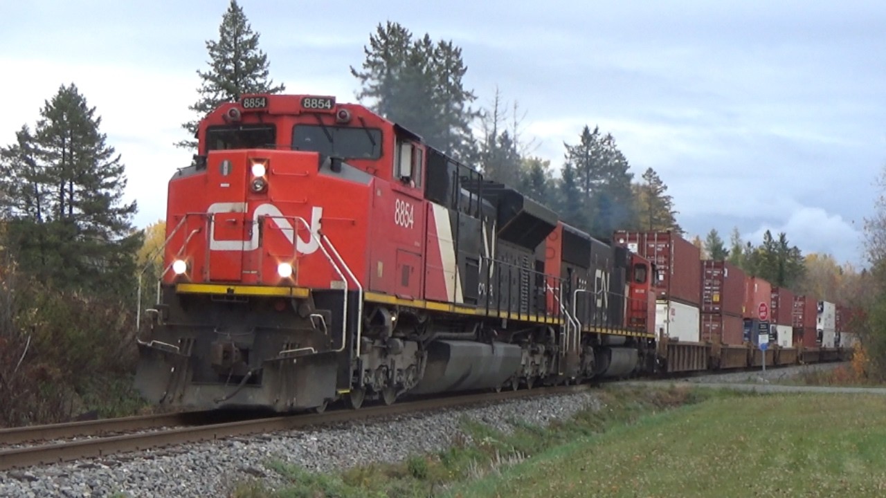 Nice EMD Motors Lead a Long Freight Train CN 594 West w/Containers pass Boundary Creek, NB