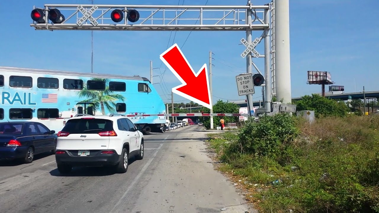 Train & Malfunctioning Railroad Crossing Gates