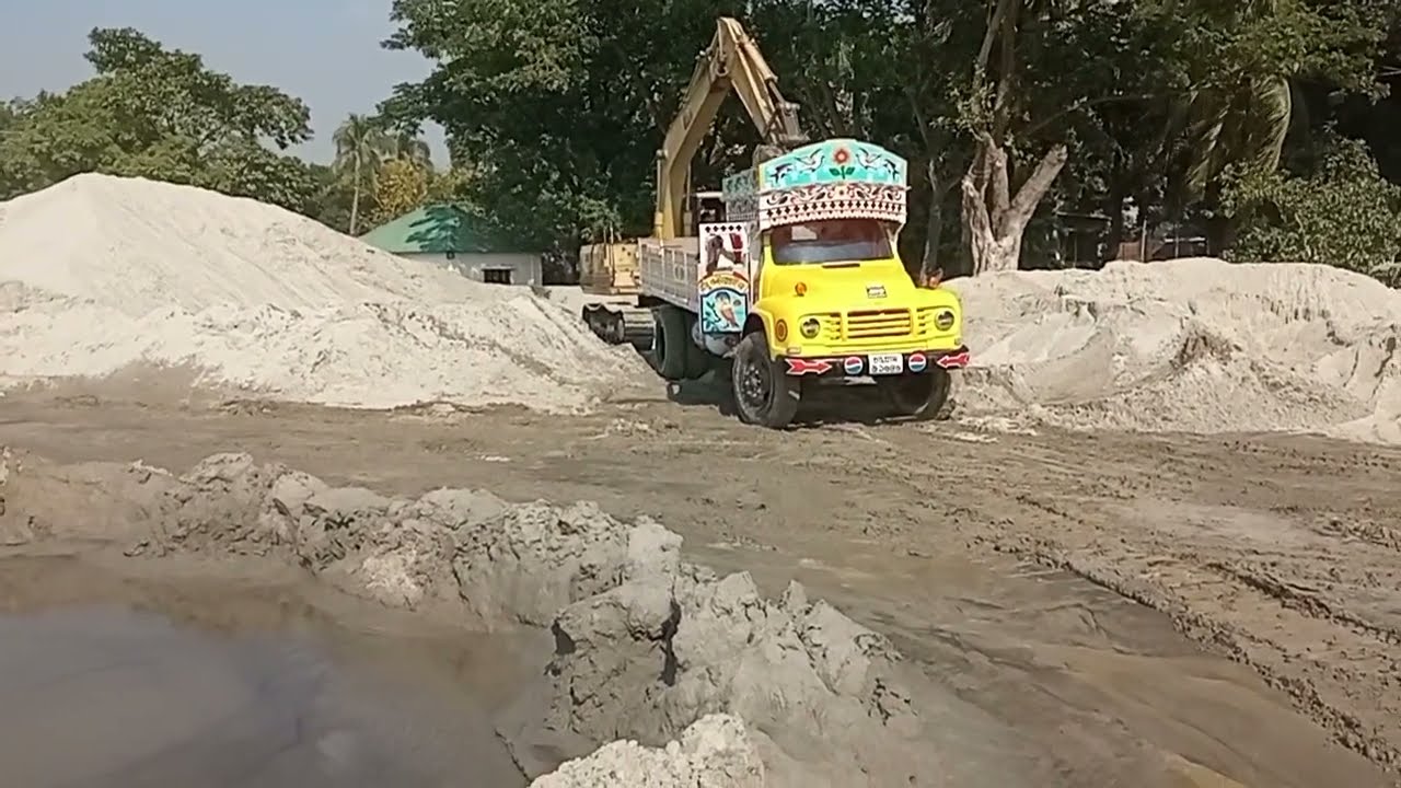 Strong old model Bedford truck load sand in sand hill side