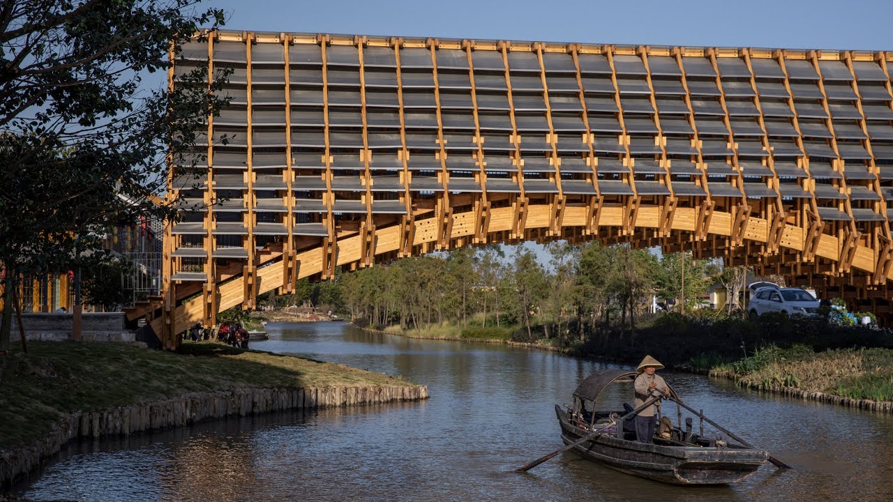LUO Studio completes intricate wooden bridge in Chinese water village
