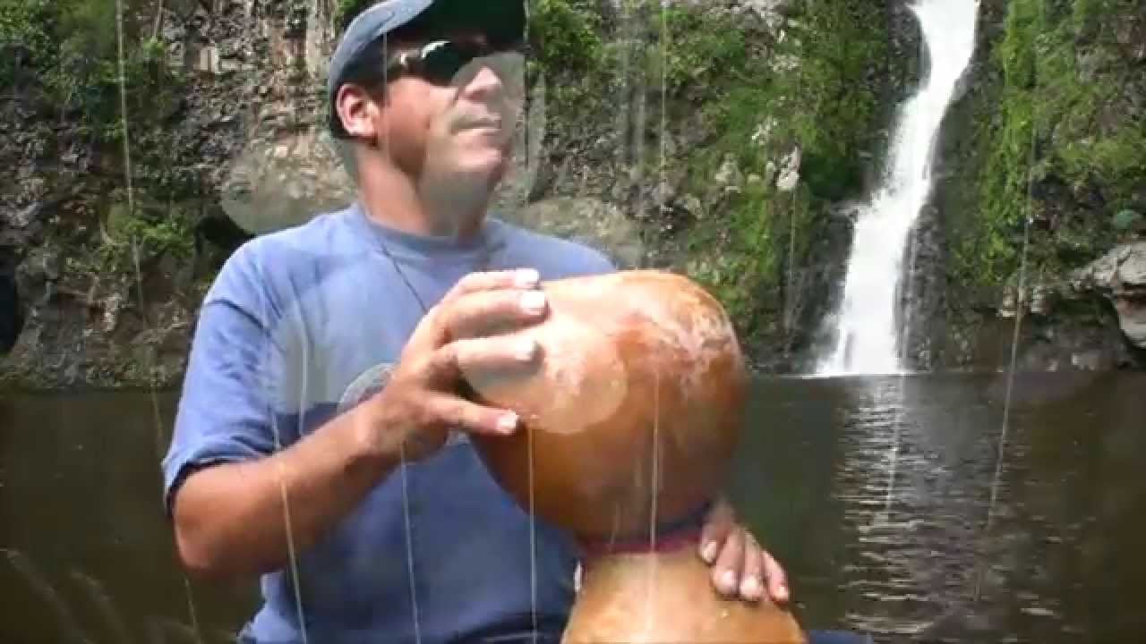 Kalae playing Ipu Heke and chanting at Halawa Falls