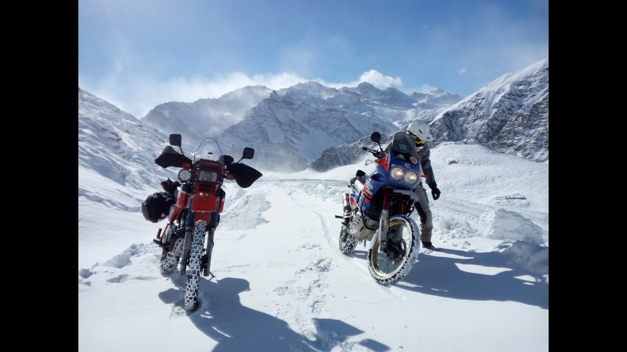 Honda XL and Africa Twin, snow chains, border crossing the Alps