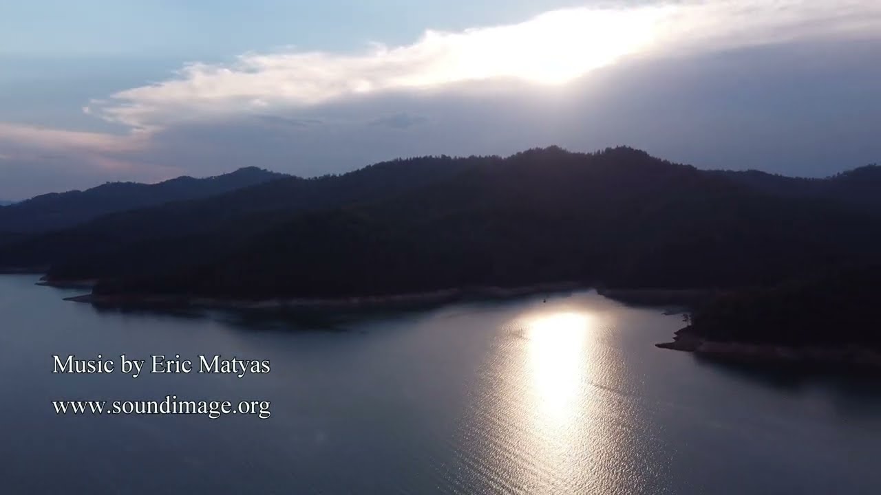 It is about to thunderstorm at sunset, McCloud River Arm, Shasta Lake, 08-2023 CA - 4k drone video