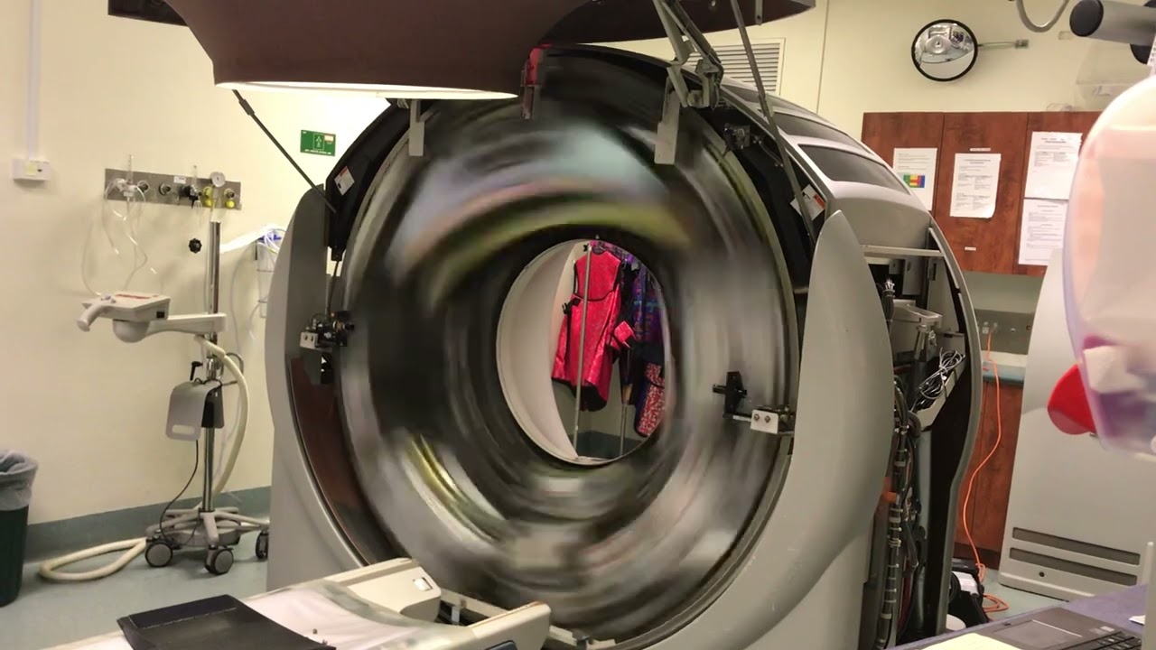Radiologist films inside of a CT scanner spinning at full speed