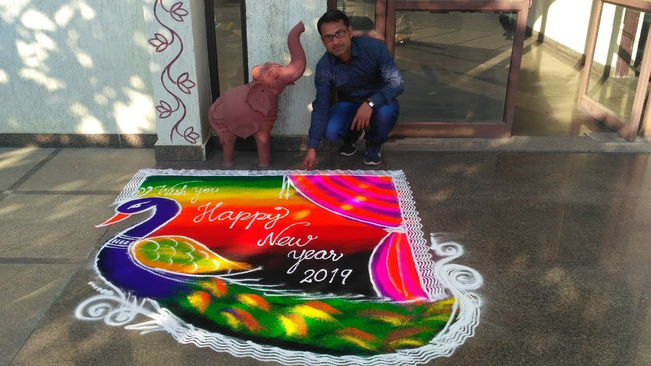 peacock rangoli design with starch powder.