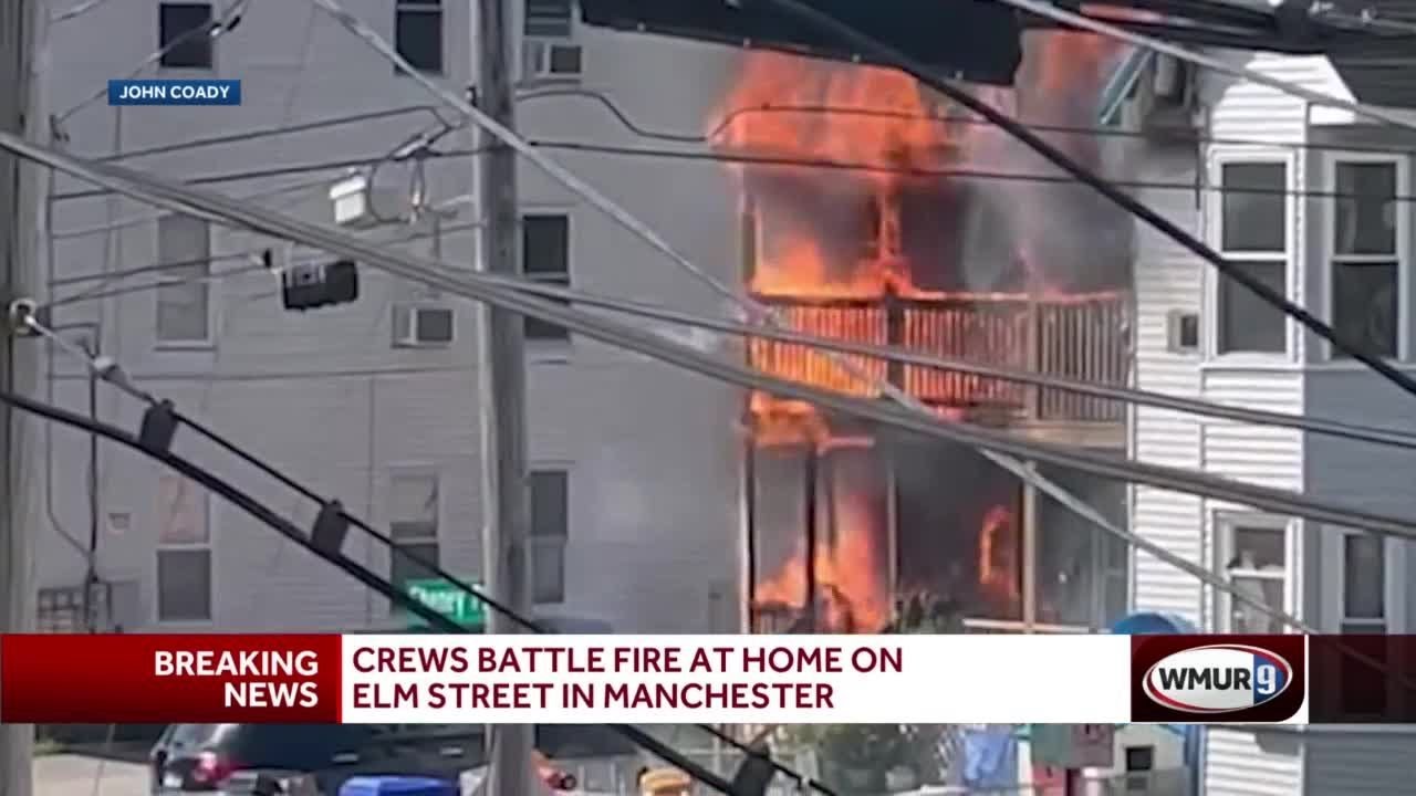 Crews battle fire at home on Elm Street in Manchester