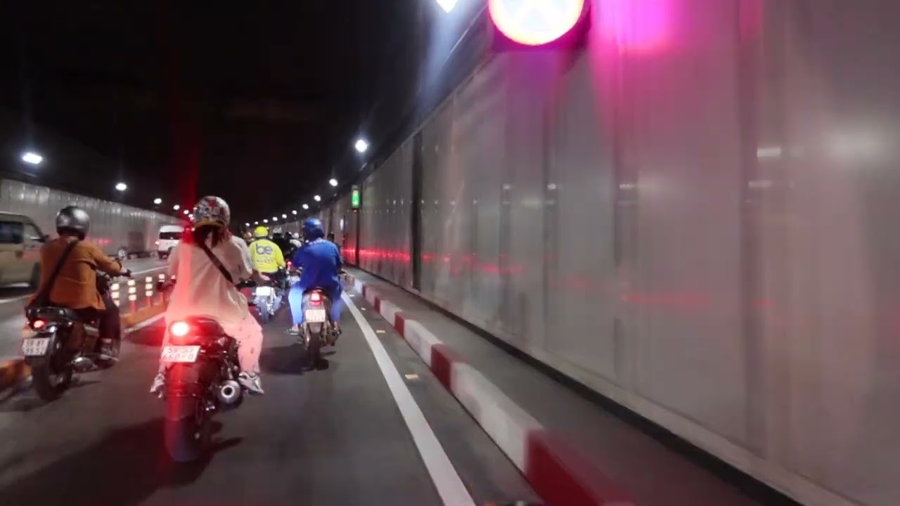 Tunnel under the river on moped, Saigon Vietnam