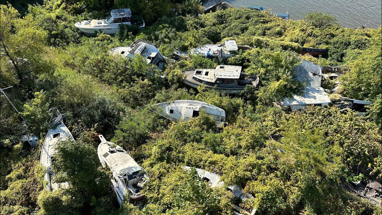 Exploring abandoned boat graveyard buried away in the woods