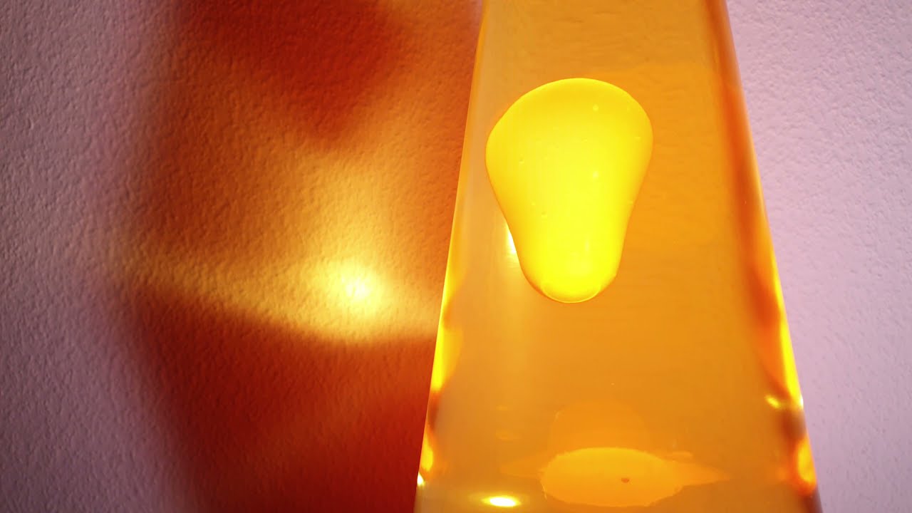 4k Clip Mathmos Astro Lavalampe orange-gelb, Hintergrundbeleuchtung weiss