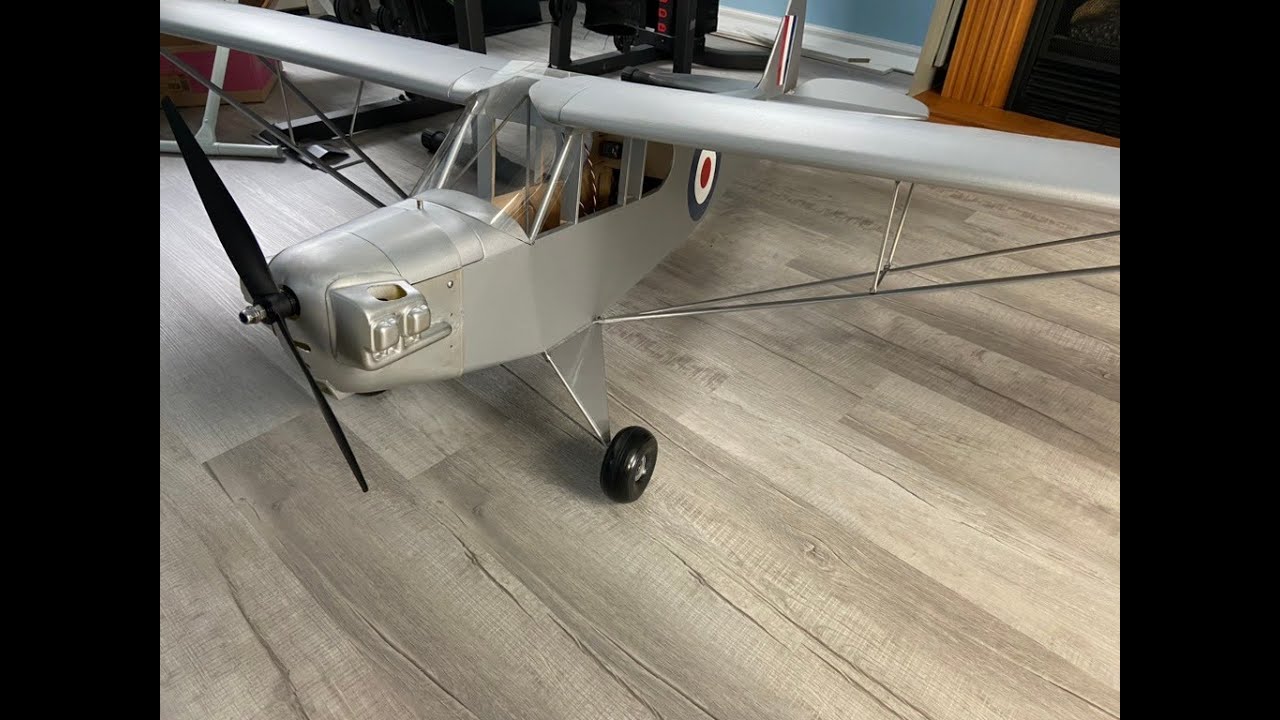 Sig 1/4 scale cub electric conversion rc plane with trapeze battery hatch.