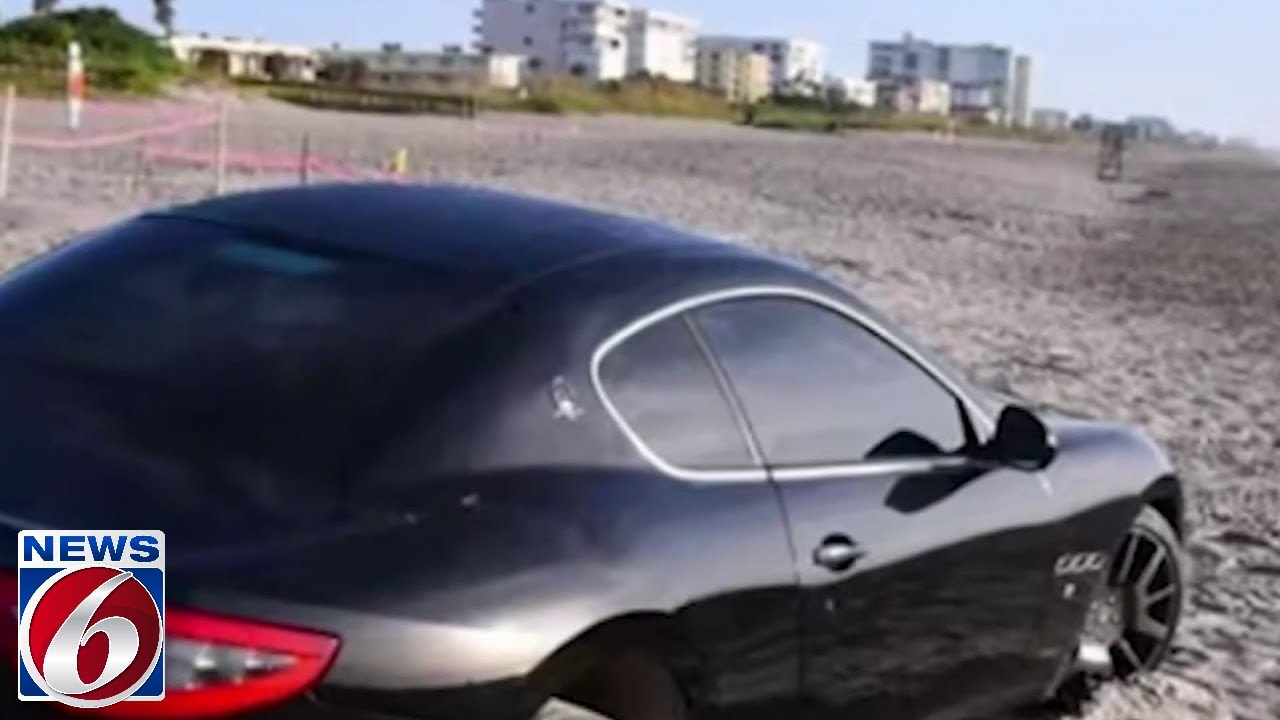 Police pursuit ends with Maserati stuck in sand at Cocoa Beach