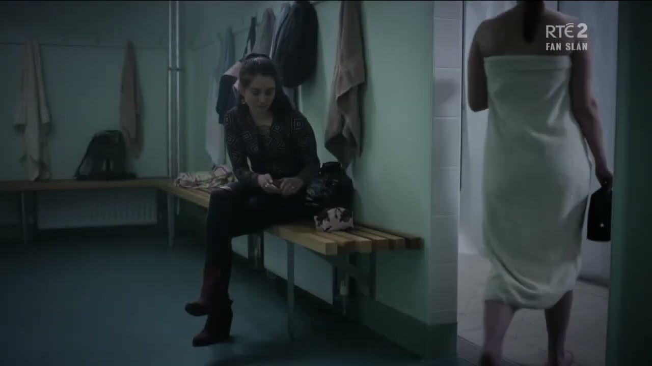 Aisling Franciosi puts her boots on wearing black socks