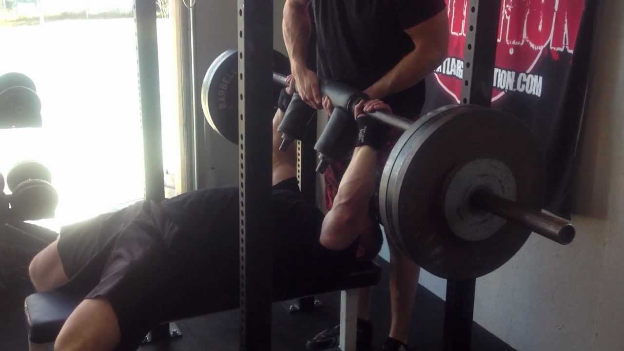 Justin Tooley performing a variation of the JM Press with a Safety Squat Bar