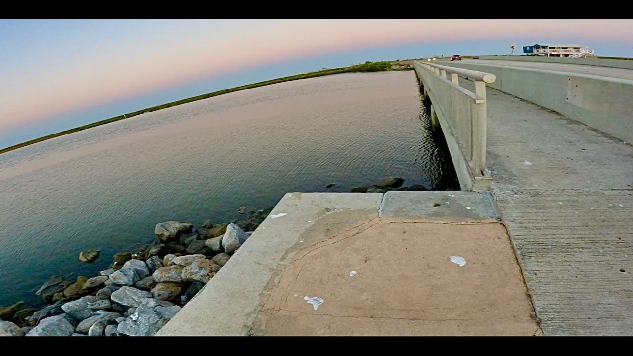 Night fishing from a bridge in Grand Isle