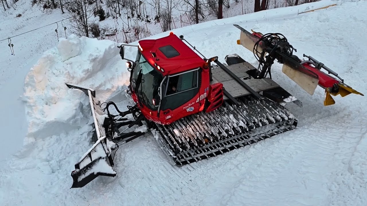 Pistenbully 400 Onboard and Drone view while Pushing Snow - Cummins Sound
