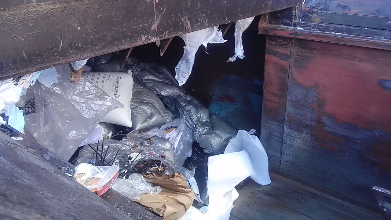 t r a s h vs e m p t y trash compactor