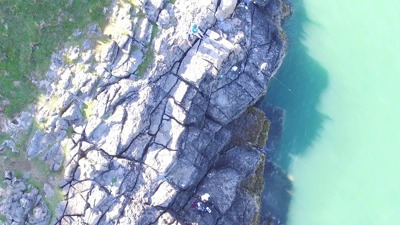 Fishing on the rocks at Benllech