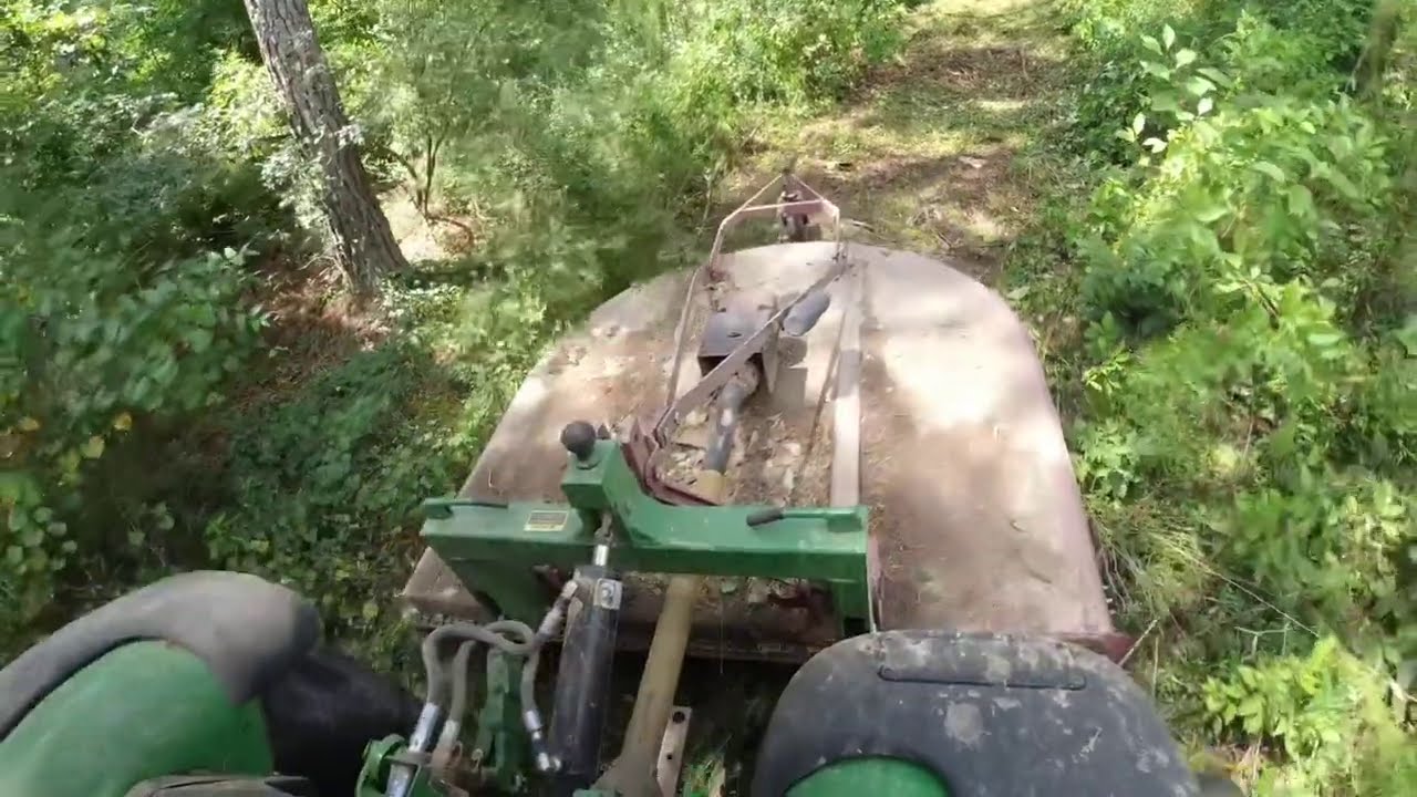 Bushhogging super thick stuff | how I clear new lanes with a Rakemaster grapple rake