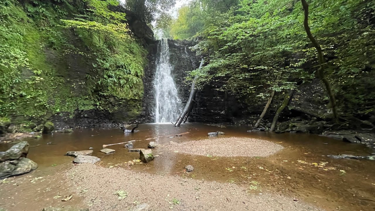 Falling foss waterfall to the hermits cave , North York moors,Goathland