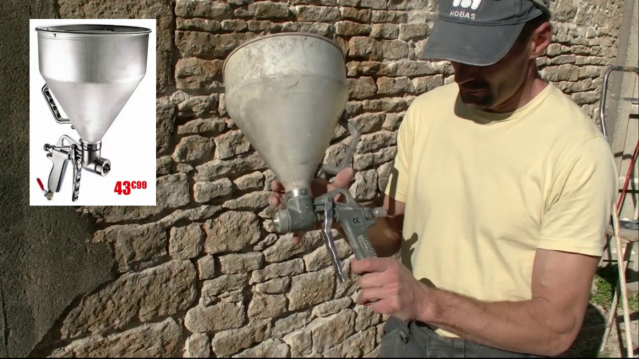 Joint de pierre avec un pistolet à crépir